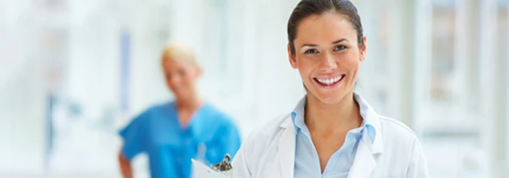 A young female doctor holding a clipboard