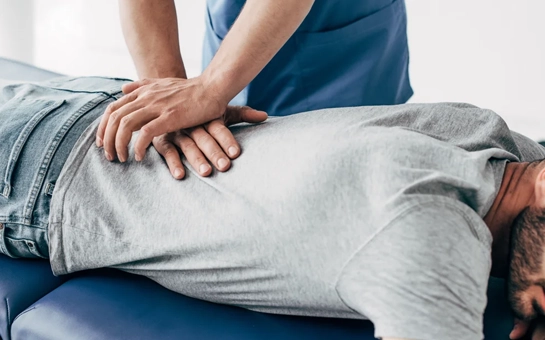 A low back adjustment for a patient on an adjustment table