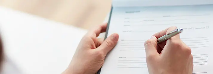A patient filling out paperwork